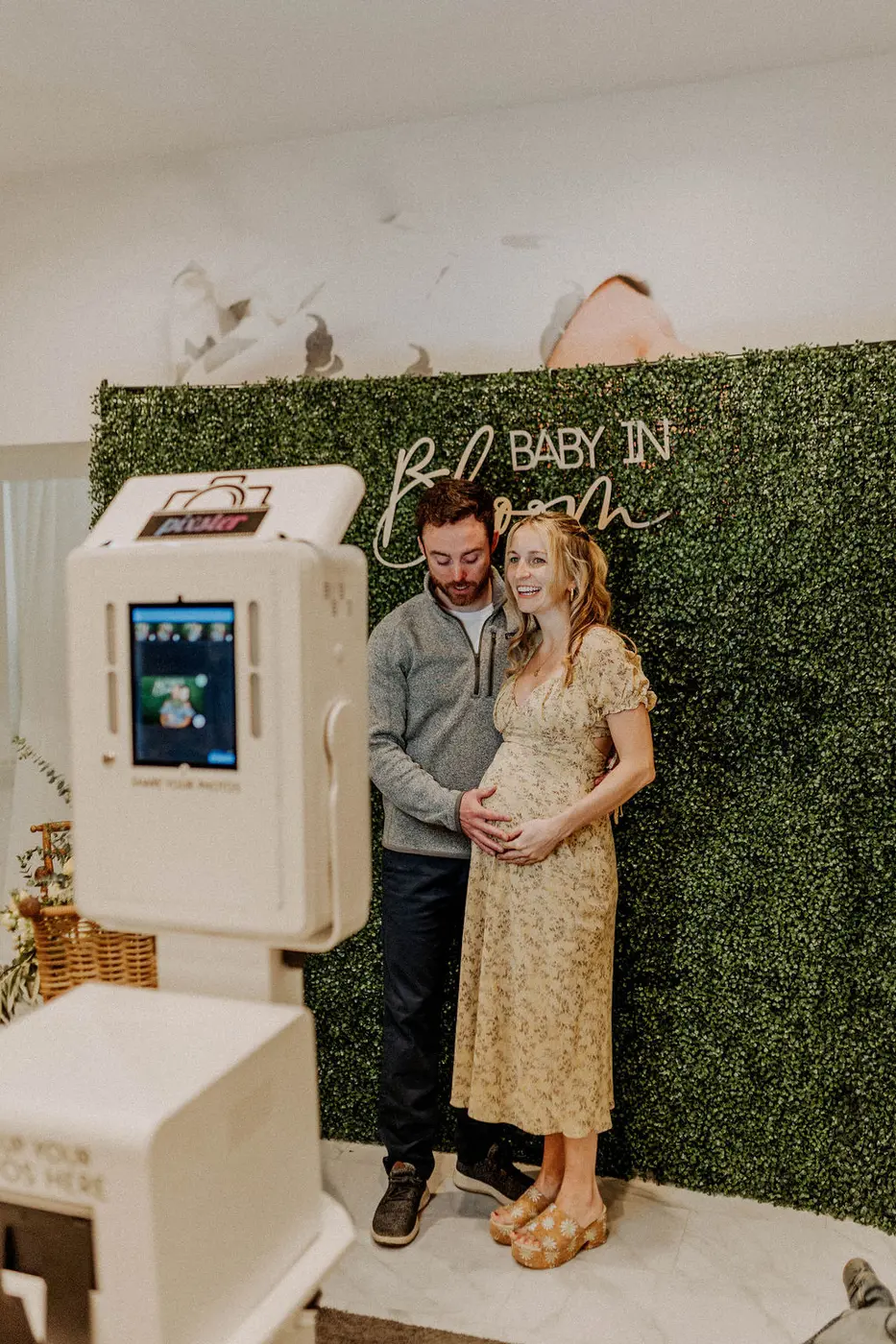 In-house pregnancy photo booth with props